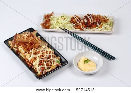 Spicy fried chicken salad (Yum Kai Zap in Thai) served mixed vegetables salad and french fires.