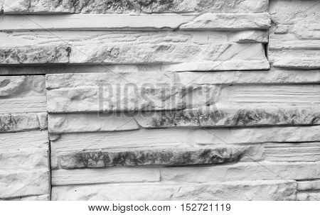 Old brick wall background. Grey stone wall texture slim briks.