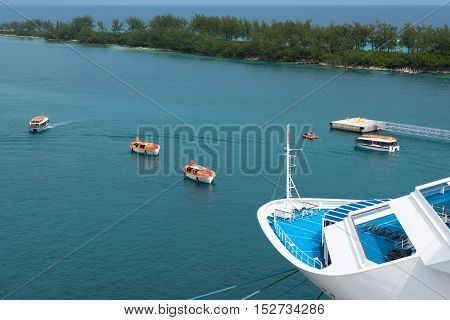 Multiple lifeboats performing a drill from a cruise ship