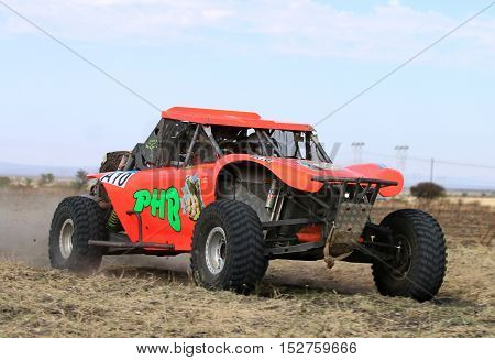Forty Five Degree Close-up View Of Speeding Orange Bat Rally Car
