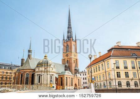 Stockholm, Sweden. The Building Of Riddarholm Kyrka Or Riddarholm Church, The Burial Place Of Swedish Monarchs On The Island Of Riddarholmen In Summer Sunny Day With Blue Sky.