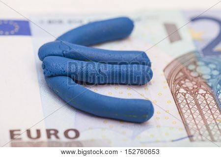Plasticine euro icon on euro banknote money