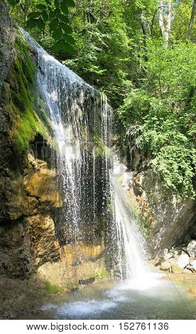 waterfall on a mountain river in the forest