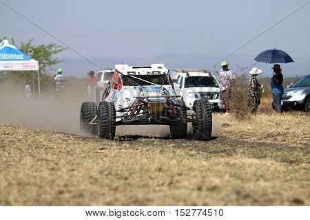 Speeding White Bat Rally Car Front View