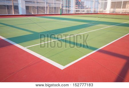 Tennis court at a top building with shadow