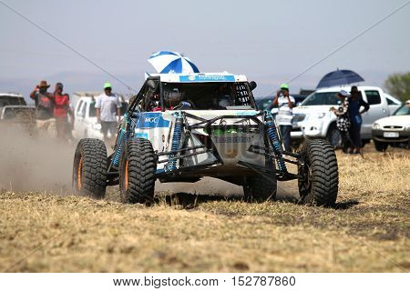 Forty Five Degree Close-up View Of Speeding White Aceco Rally Car