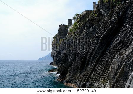 Sea and rocky cliff In Vernazza in Liguria Italy. One of five Cinque Terre cities (unesco world heritage)