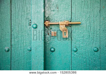 Wooden door of a traditional Omani house in Wakan Village