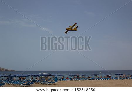 BENIDORM SPANE - 28 June 2016: Hydroplane flying over beach