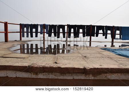 Pants drying at the sun on the ghats of Varanasi, Uttar Pradesh, India