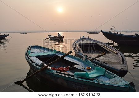 Sunrise with boats on river Ganga, Varanasi, India
