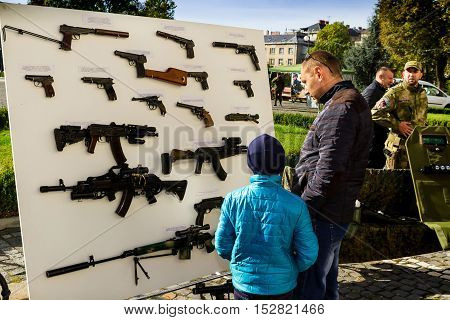 Uzhgorod Ukraine - 14 October 2016: Local residents consider the exhibition of small arms during the celebration of Defender of the Fatherland Day. This day Ukraine celebrates the Day of Defender of the Fatherland.