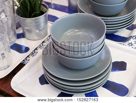 Kitchen Utensil Set of Porcelain Dishes Bowls and Plates Preparing for Serve Hot and Cold Food.