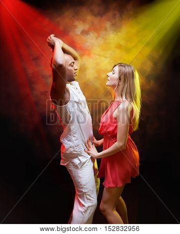 Young and sexy couple dances Caribbean Salsa