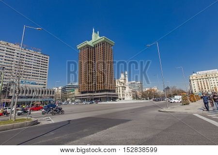 MADRID, SPAIN - MARCH 16, 2016: Unidentified people at Plaza de Colon in Madrid Spain. This plaza and its fountain commemorate the explorer Christopher Columbus.