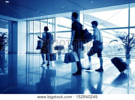 Passengers at the Shanghai airport, blue tones.