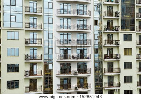 Multi-storey building skyscraper with balconies. Apartment house