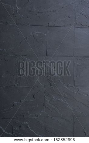black granite stone wall background and texture