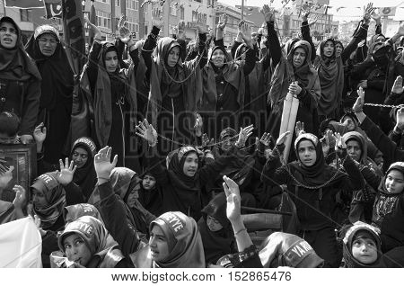 Istanbul Turkey - October 11 2016: Muslims worldwide marks Ashura Istanbul Shiite community. Turkish Shia Muslims mourning for Imam Hussain. Caferis take part in a mourning procession marking the day of Ashura in Istanbul's Kucukcekmece district Turkey on