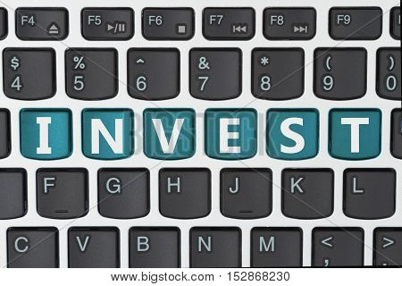 Doing your investing online A close-up of a keyboard with teal highlighted text Invest