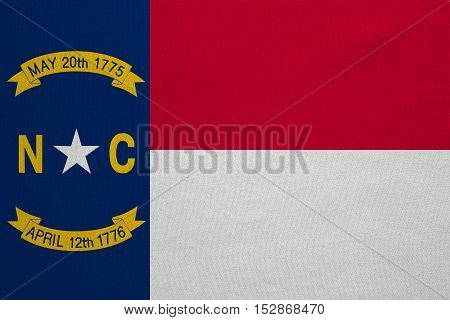 Flag of the US state of North Carolina. American patriotic element. USA banner. United States of America symbol. North Carolinian official flag detailed fabric texture illustration Accurate size color