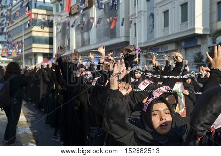 Istanbul Turkey - October 11 2016: Muslims worldwide marks Ashura Istanbul Shiite community. Turkish Shia Muslims mourning for Imam Hussain. Caferis take part in a mourning procession marking the day of Ashura in Istanbul's Kucukcekmece district Turkey on