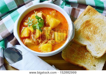 Chicken Mussaman Curry (Thai food menu) with toast.