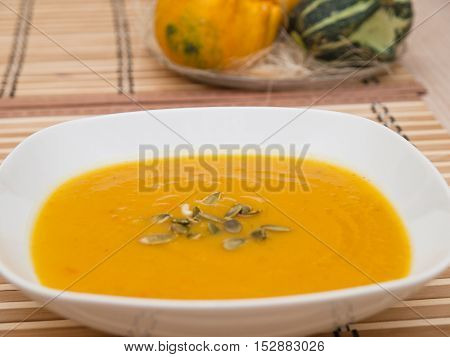 spicy pumpkin soup with roasted pumpkin seeds