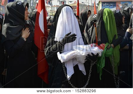 Istanbul Turkey - October 11 2016: Muslims worldwide marks Ashura Istanbul Shiite community. Turkish Shia Muslims mourning for Imam Hussain. Caferis take part in a mourning procession marking the day of Ashura in Istanbul's Kucukcekmece district Turkey on