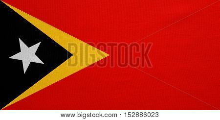 East Timorese national official flag. Patriotic symbol banner element background. Correct colors. Flag of East Timor with real detailed fabric texture accurate size illustration