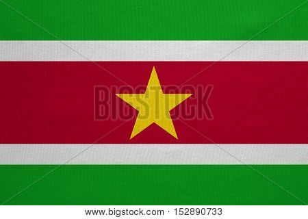 Surinamese national official flag. Patriotic symbol banner element background. Correct colors. Flag of Suriname with real detailed fabric texture accurate size illustration