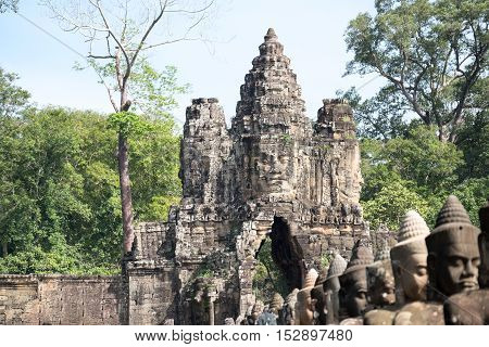Faces belong to the bodhisattva or diety on the gate of Angkor Thom,Siem Reap,Cambodia.