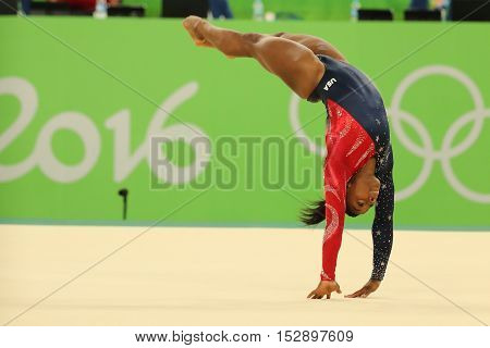RIO DE JANEIRO, BRAZIL - AUGUST 7, 2016: Olympic champion Simone Biles of United States competes on the floor exercise during women's all-around gymnastics qualification at Rio 2016 Olympic Games