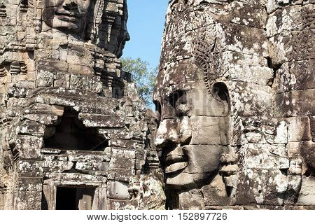 Smiling, gargantuan face at Angkor Thom, Siem Reap, Cambodia.