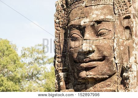 Smiling, gargantuan face at Angkor Thom, Siem Reap, Cambodia.