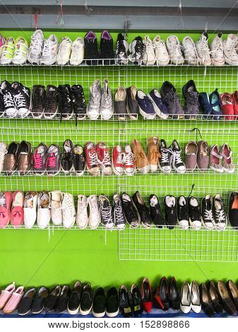BANGKOKTHAILAND-Sep 21 : Rows of second hand shoes put on sale in the market fair Septembe 212016 in BangkokThailand.