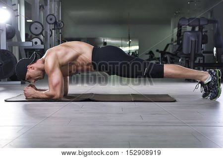 Handsome Powerful Athletic Man Doing Plank Exercise. Strong Bodybuilder With  Perfect Muscular Abs,