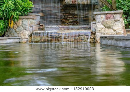 The landscape of beautiful waterfall in garden