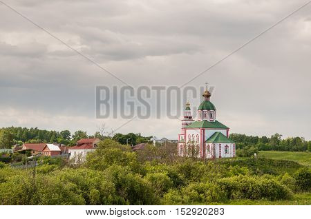 View of the Church of Elijah the Prophet on Ivanova mountain or Elias Church before the storm in Suzdal Russia. Golden Ring of Russia.