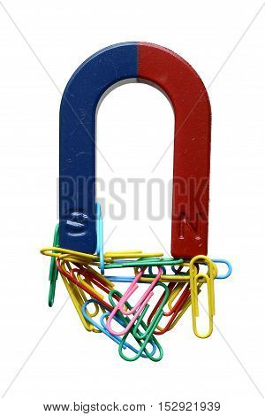 Magnet and paper clips isolated on a white background.