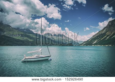Amazing sunny day at Champferersee lake in the Swiss Alps. Silvaplana village, Switzerland, Europe. Toned like Instagram filter