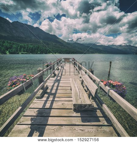 Amazing sunny day at Champferersee lake in the Swiss Alps. Silvaplana village, Switzerland, Europe. Toned like Instagram filter