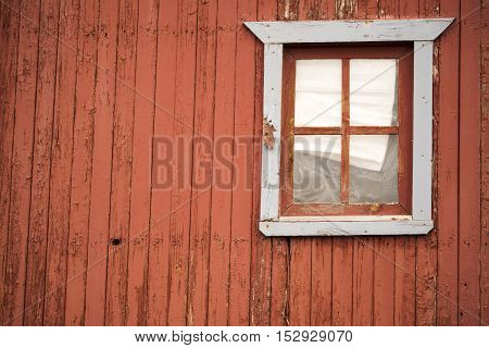 A window on a rustic mountain cabin in Cripple Creek Colorado