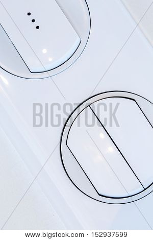 front view on Plastic white dimmer light switch closeup