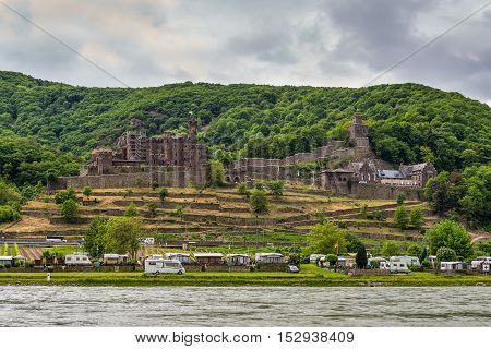 Trechtingshausen Germany - May 23 2016: Camping Marienort in Trechtingshausen near Reichenstein castle in cloudy weather Rhine Valley Rhineland-Palatinate Germany UNESCO World Heritage Site.
