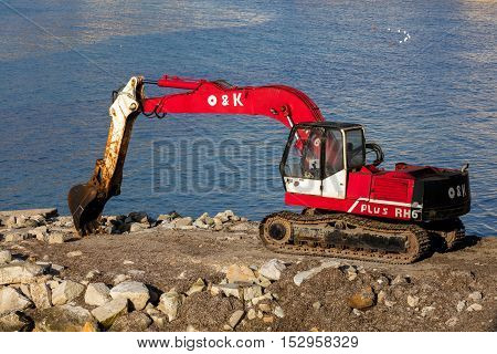 TRAPANI ITALY - AUGUST 10 2016: O&K Tracked Excavator RH6-22 on the waterfront in Trapani Sicily