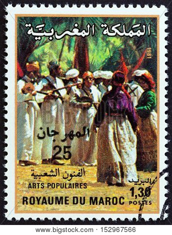 MOROCCO - CIRCA 1981: A stamp printed in Morocco issued for the 22nd National Folklore Festival, Marrakesh shows folk musicians, circa 1981.