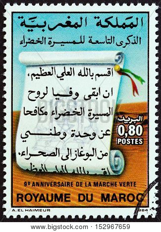 MOROCCO - CIRCA 1984: A stamp printed in Morocco issued for the 9th anniversary of "The Green March " shows Scroll, circa 1984.