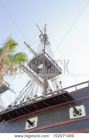 detail of cannons and maintop of an ancient warship
