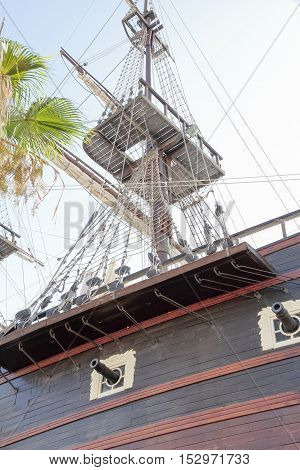 detail of cannons and maintop of an ancient warship